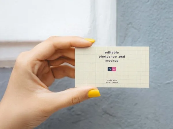 Top View of a Hand Holding a Business Card Mockup 1