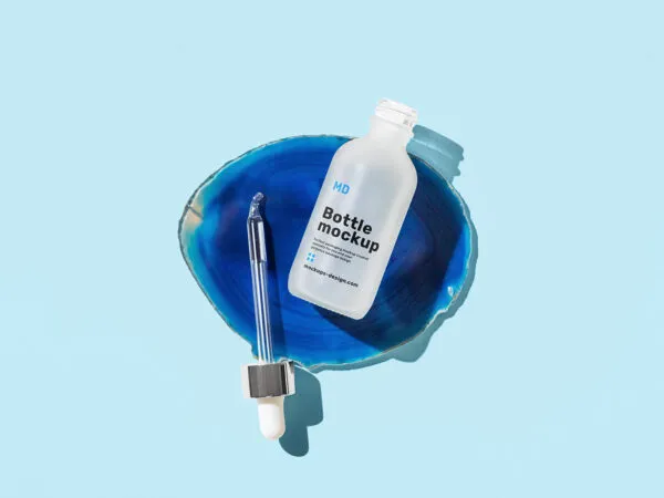 Top View of a Realistic Dropper Bottle Mockup 1