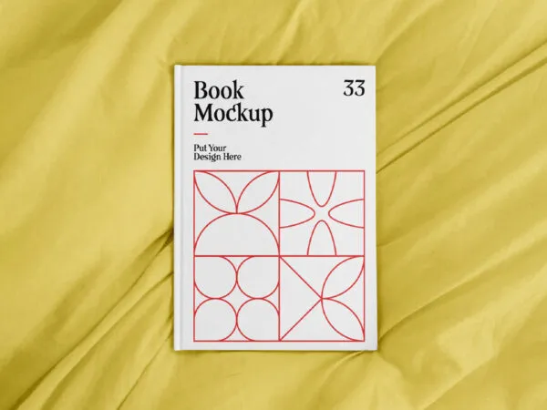 Top View of an A4 Book Hardcover on a Sheet Mockup 1