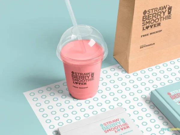 Transparent Plastic Cup Mockup Next to Bag Book and Notepad 1