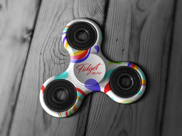 Tri Fidget Spinner on a Wooden Surface Mockup 1