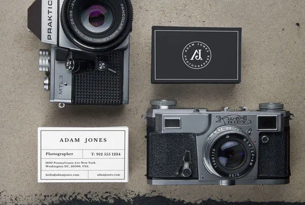 Two Business Card Mockups Next to Vintage Cameras 1
