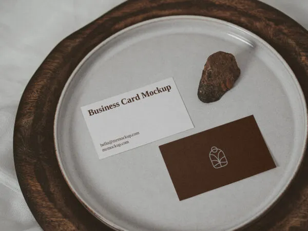 Two Business Cards on a Plate with a Little Rock Mockup 1