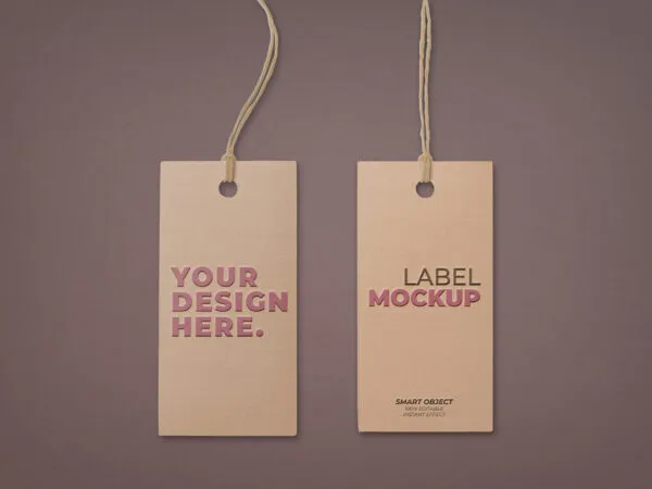 Two Embossed Hangtags Laid on the Surface in Top View Mockup 1