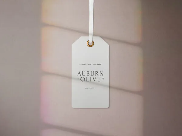 Two Mockups Featuring Hanging Garment Label Tags 1