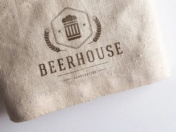 Two Mockups Showing Logo on Cardboard and Sack 1