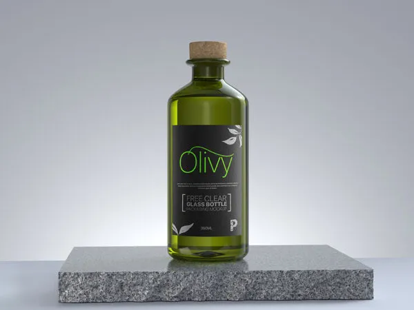 Vertical Clear Oil Glass Bottle on a Rock Mockup 1
