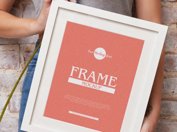 Vertical Photo Frame Mockup Featuring a Girl Holding it Diagonally 1