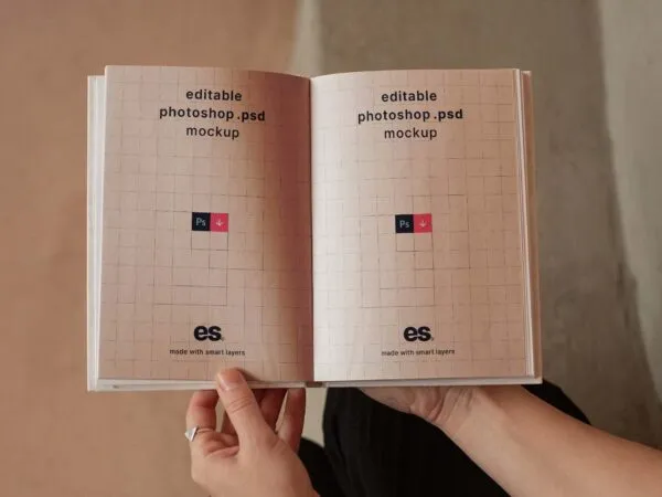 Woman Hand holding Opened Hardcover Book Mockup 1
