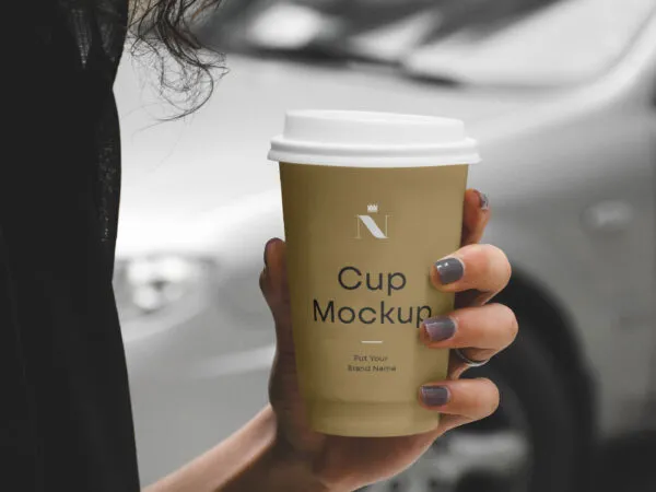 Woman Holding Coffee Cup Mockup 1