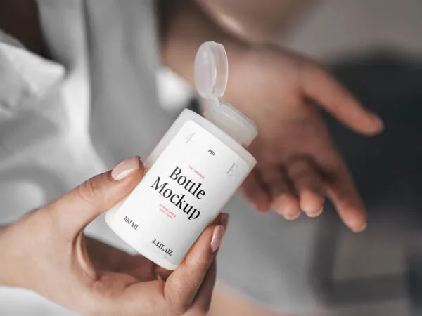 Woman Holding Realistic Mini Bottle Mockup from Top View 1