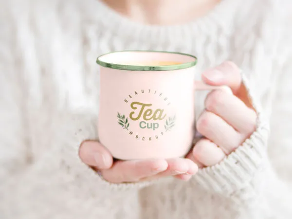 Woman Holding Tea Mug in Hand Mockup 1