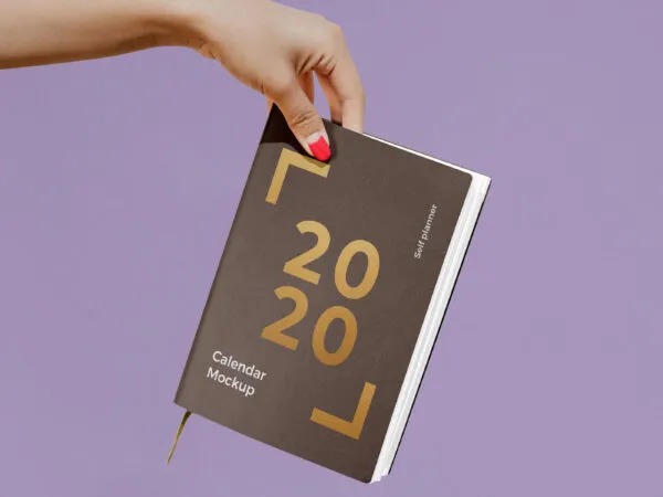 Woman Holding a Notebook Calendar Mockup 1