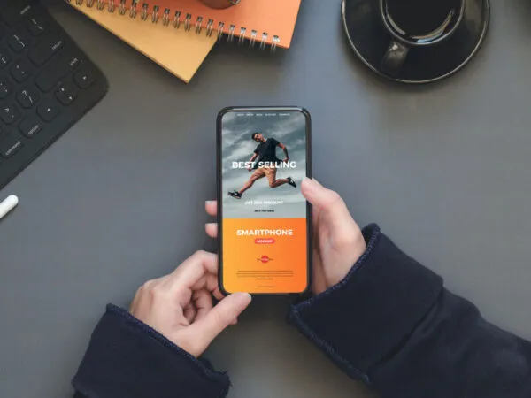 Workstation Mockup of Smartphone in a Persons Hand 1