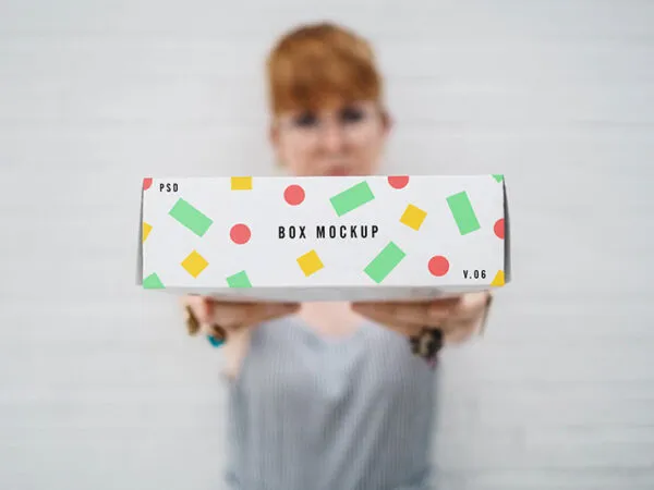 a Woman Handing out a Box Mockup 1